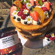 Load image into Gallery viewer, Decorative cake with fruits and Yorkshire Preserves jar on a rustic surface