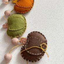 Load image into Gallery viewer, Felt pumpkin garland with colorful pumpkins on a light background
