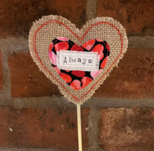 Load image into Gallery viewer, Heart-shaped decorative item with 'Always' label against a brick wall
