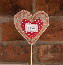 Load image into Gallery viewer, Heart-shaped decoration with 'Love' text against a brick wall
