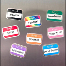 Load image into Gallery viewer, Colorful name tag magnets on a metallic surface
