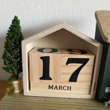 Load image into Gallery viewer, Wooden calendar block displaying '17 March' on a wooden surface with a decorative plant in the background.

