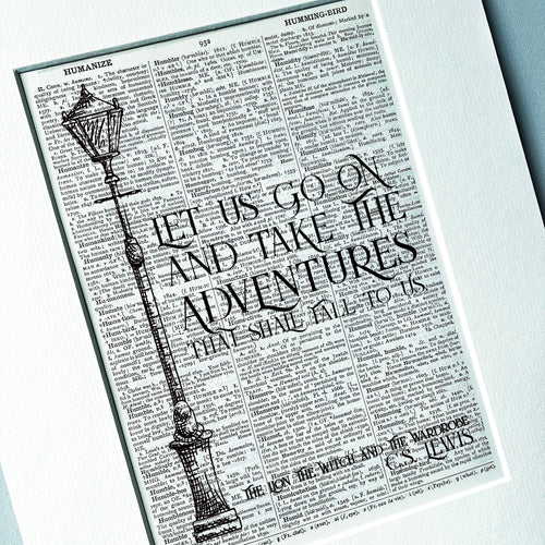 Print with a quote and vintage-style street lamp on a white background