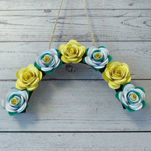 Load image into Gallery viewer, Yorkshire Rose inspired floral arch made of paper flowers on a wooden surface
