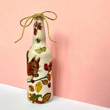 Load image into Gallery viewer, Decoupaged Beer Bottle - Red Squirrel and Leaves Design - The Upcycled Shop
