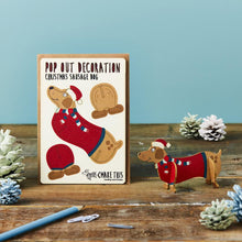 Load image into Gallery viewer, Festive Sausage Dog - Wooden Pop Out Christmas Card and Decoration - card and gift in one - The Pop Out Card Company
